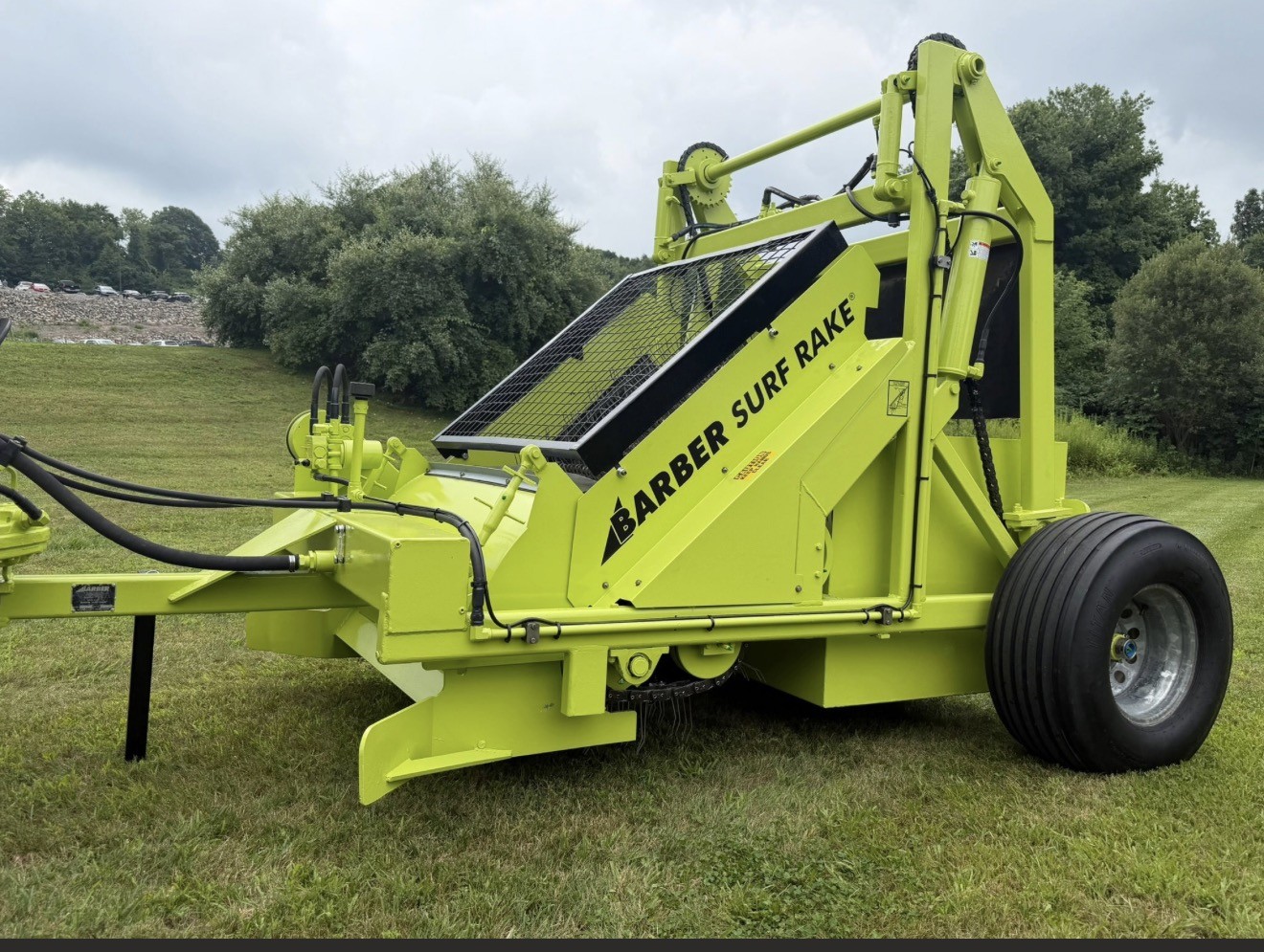 Beach-cleaning equipment used for shoreline sand grooming